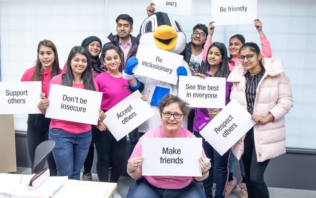 Jill and her ECE students get together for the Pink Shirt Day - A Stand Against Bullying