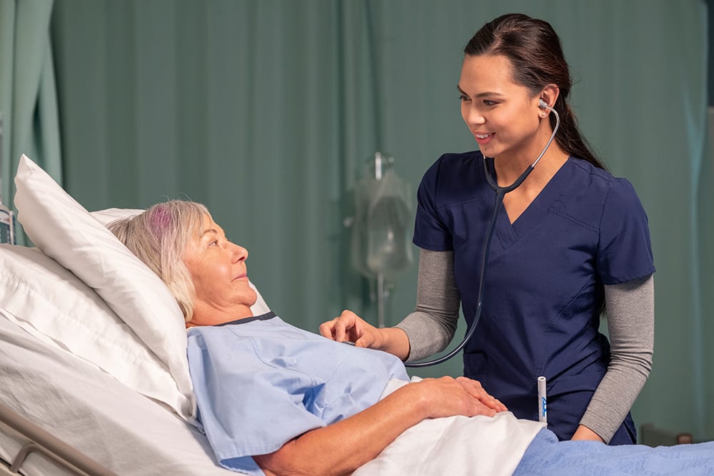 Practical Nurse caring for elderly lady. There