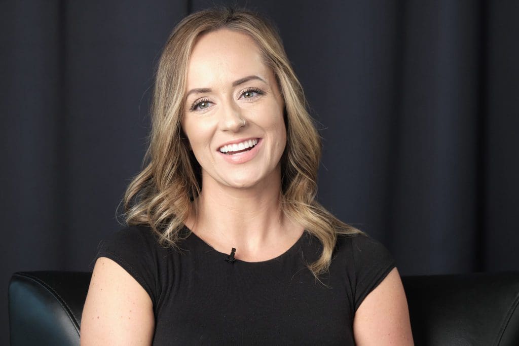 Hannah smiles in a candid moment to the camera