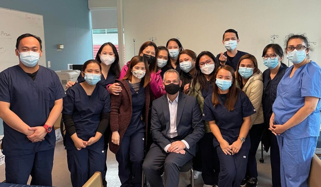 Ira Mariano and her classmates with Jeremy Sabell, President of Stenberg College.