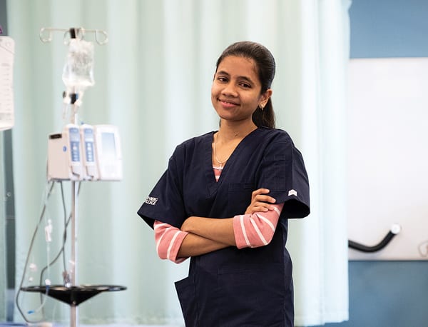 Ivane at the lab. She worked hard to get familiar with the Canadian Health Care system, but now is a successful HCA.