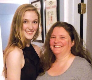 Maddie and her mom at home. Behind a strong educator there is always a big role model.