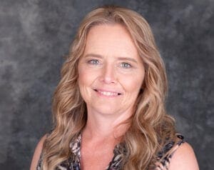 Michelle smiles to the camera. She graduated as a Community Mental Health worker and loves it!