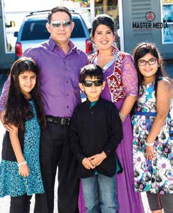 Neetu smiles with her 3 kids. Being a parent of a child with specialized needs showed her the path to her dream.