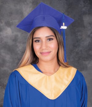 Raji wearing a Grad Gown. She graduated from her HSS program and was a Student of the Year finalist.