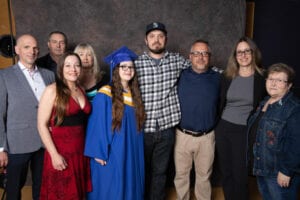 Sammi and her boyfriend and family at her Graduation. They all came to share her happiness.
