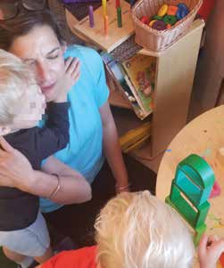 Young kid hugging Simrajit. She is naturally good with children and they love her!