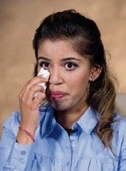 Simran wipe her tears remembering the struggles of her childhood. She was able to support herself and become a caregiver.