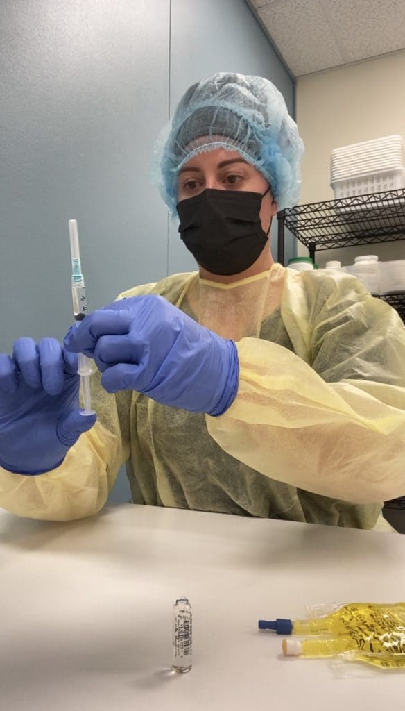 Sheri practicing with the syringe