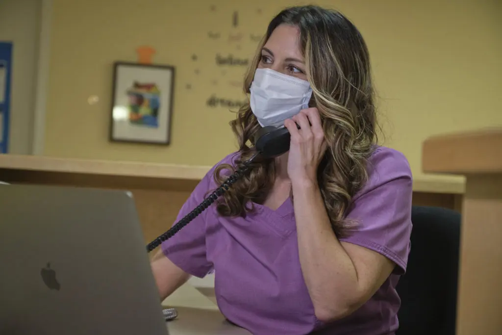 renee working in the hospital, on the phone