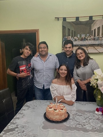 Berenice celebrating with her family.